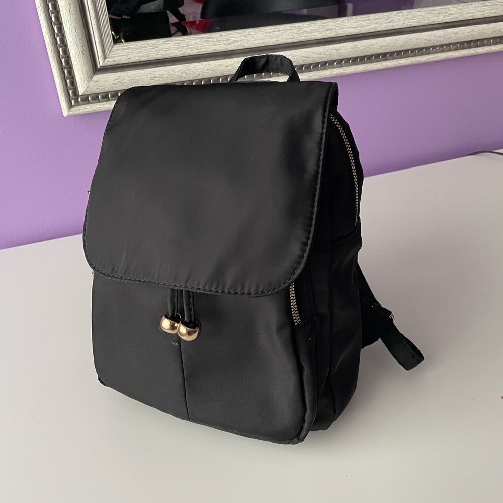 Medium size backpack with cheetah print lining - Picture 2 of 9